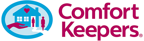 "Comfort Keepers logo with a caring hand, home, and figures representing in-home care services."