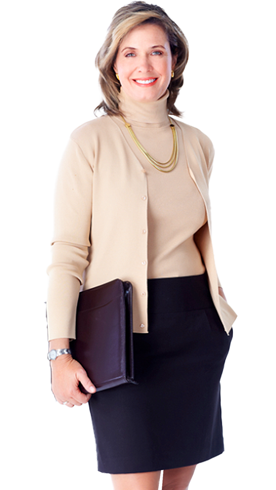 A business woman in a tan sweater and black skirt works at an Indianapolis Marketing Agency.